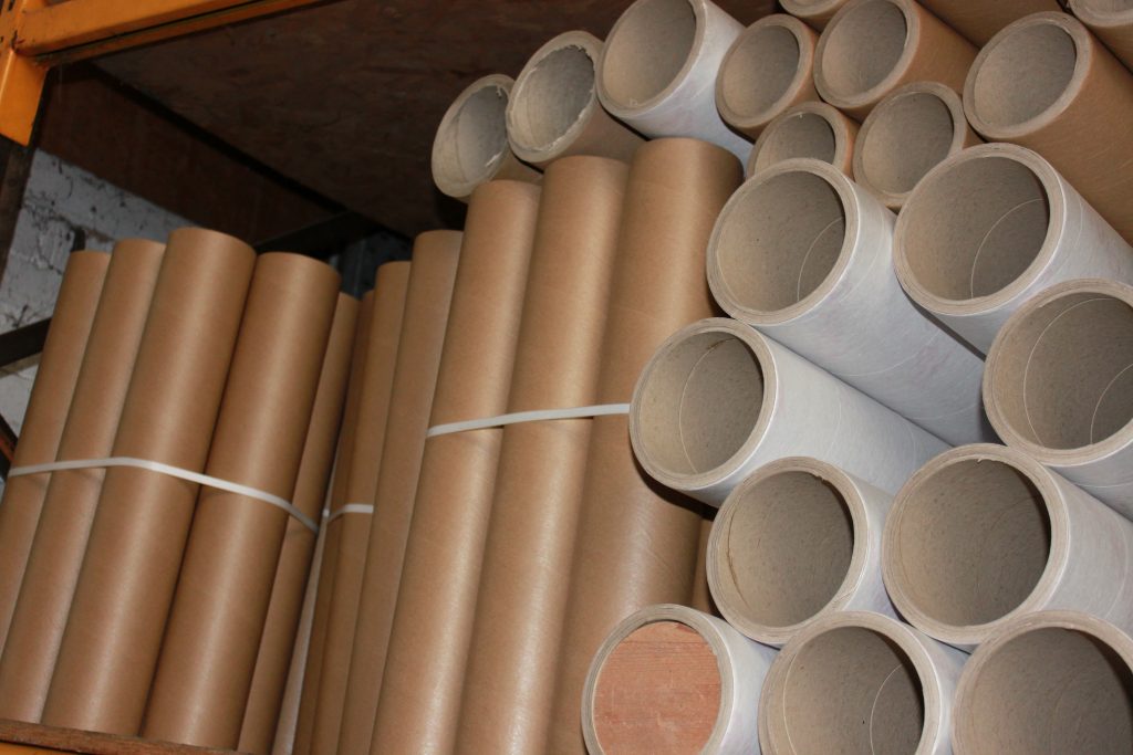 Group of large cardboard tubes tied together