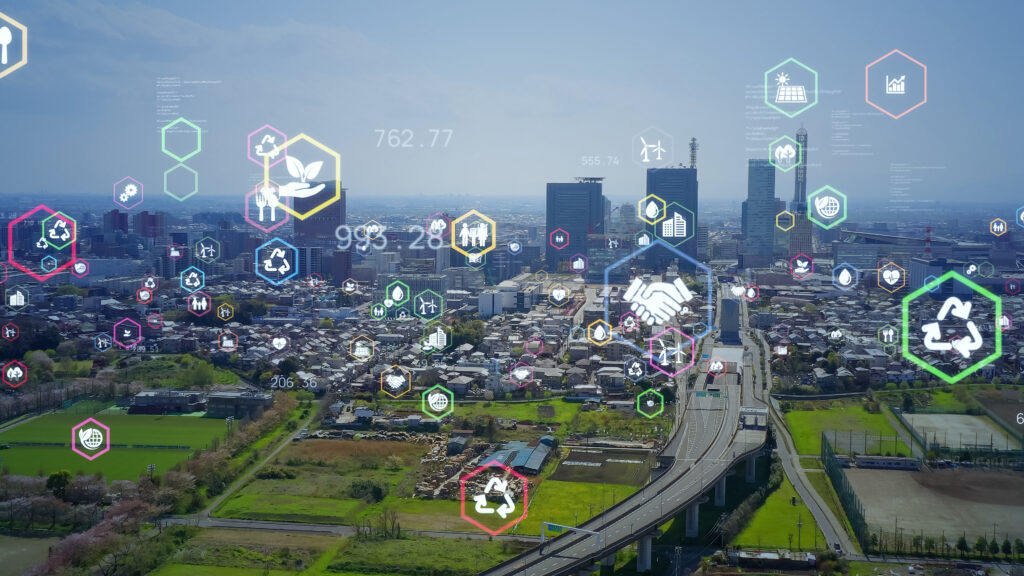 image of a city with graphics of small icons related to sustainability