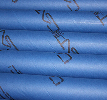 blue cardboard tubes with branding stacked on top of each other