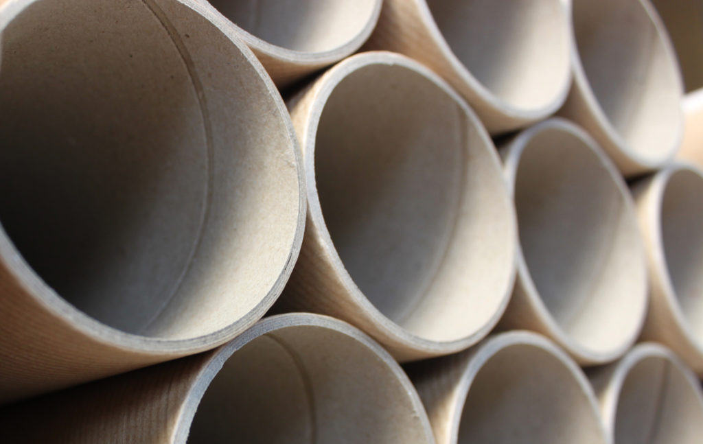 closeup image of cardboard tubes stacked on each other