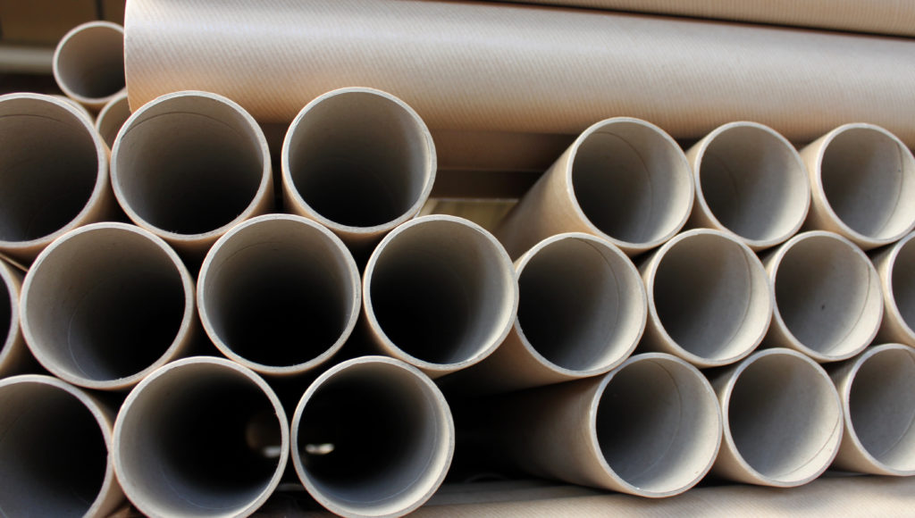 Multiple cardboard tubes stacked on each other