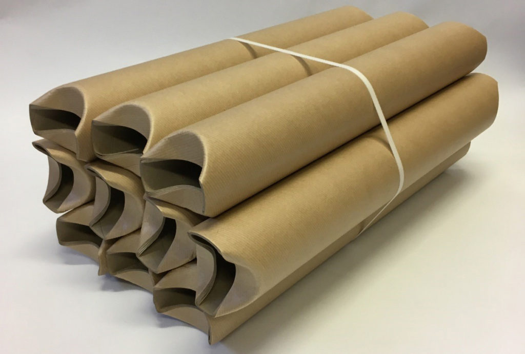 Stack of small cardboard tubes with tucked ends tied together