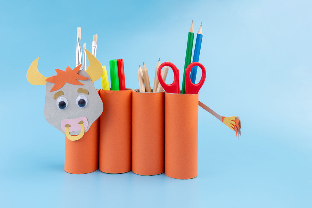 cardboard tubes as pencil, pens and paint brush holders made into a bull.