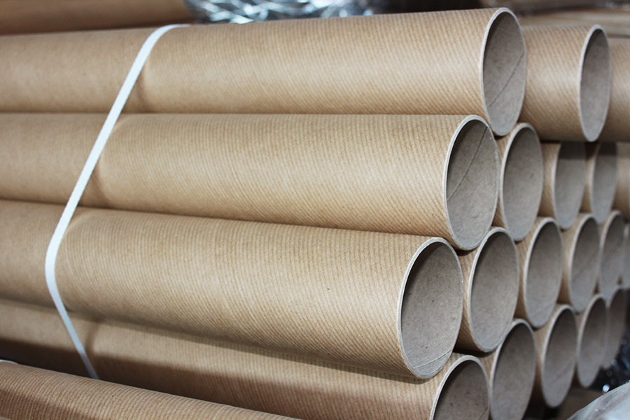 Cardboard tubes stacked on each other tied together